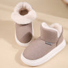 Keep feet warm & cozy with Unisex Winter Slippers. Breathable suede, plush lining, anti-slip PVC sole. Available in brown, khaki, red, or gray.