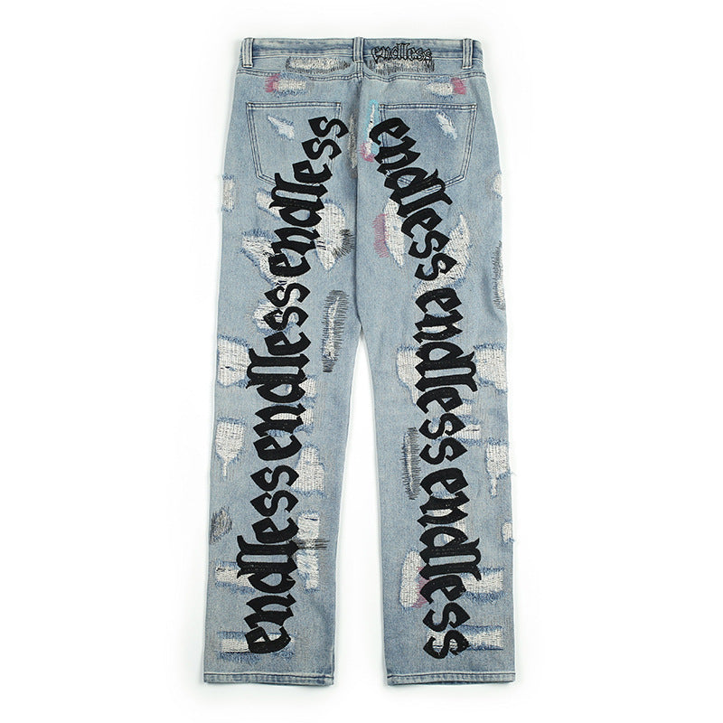 Embroidered ripped vintage jeans trousers