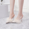 Women's Chic Stiletto Heeled Slippers with Tassels in Black Suede. Stylish mid-heel design with tassel detail for added charisma.