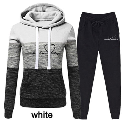 Trendy Two-Piece Tracksuit Set with Cozy Hoodie. Casual, Comfortable Women's Lounge Wear in Various Sizes. Durable Polyester Fleece Sweater Suit.