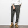Trendy Urban Striped Cotton Harem Pants for Teens - Loose fit with low waist, striped pattern. Perfect for youthful leisure wear.