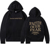 Inspirational "Faith Over Fear" Unisex Hoodie in cotton blend fabric with empowering inscription and street-style flair.