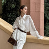 Chic Crepe Bell Sleeve Shirt with Bow Tie - Elegant See-Through Style.