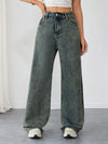 Flat lay of Sunset Boulevard wide-leg jeans with urban chic accessories.