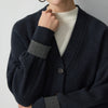 Classic V-neck wool cardigan with expert rib knit texture and elegant draping