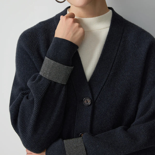 Classic V-neck wool cardigan with expert rib knit texture and elegant draping