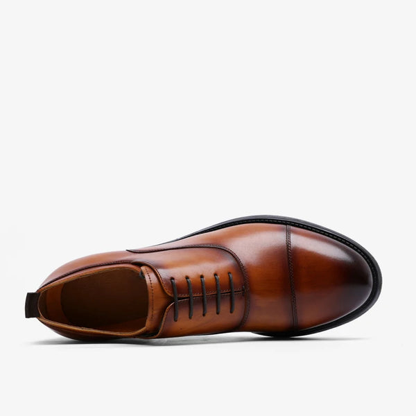 Handcrafted leather Oxford flats showing detailed hand-stitching and premium construction
