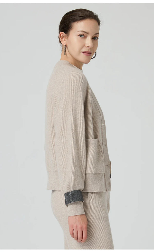 Luxurious loose fit wool cardigan featuring expert rib knit construction and elegant silhouette
