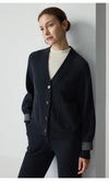 Elegant loose fit wool cardigan with expert ribbing and breathable heavyweight construction