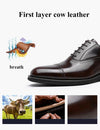 Desai Classic Leather Oxfords styled with a business suit for a professional look.
