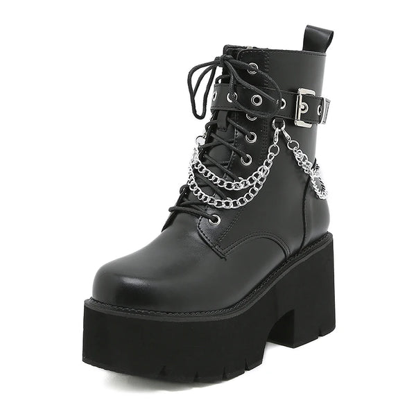 Statement platform boots featuring metal chain decoration and edgy black design