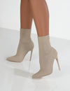 Detail of soft knit fabric ankle construction on stiletto heel boots