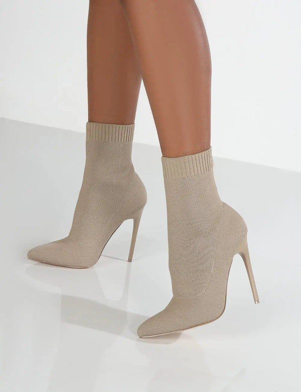 Detail of soft knit fabric ankle construction on stiletto heel boots