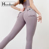 High-waist black yoga leggings with pockets for women, made of nylon and spandex.