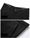 Elegant men's slim fit dress pants in solid black, perfect for formal attire and everyday office wear, made from durable poly