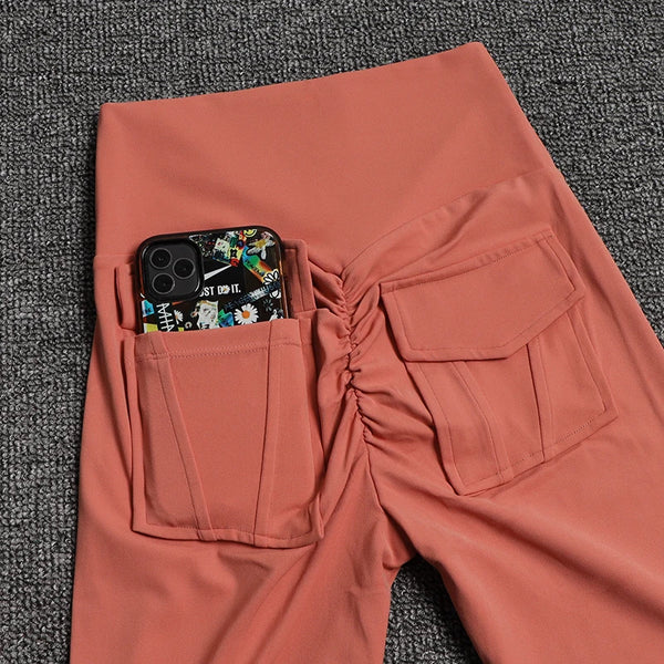 Black high-waist leggings with utility pockets, perfect for workouts and errands.