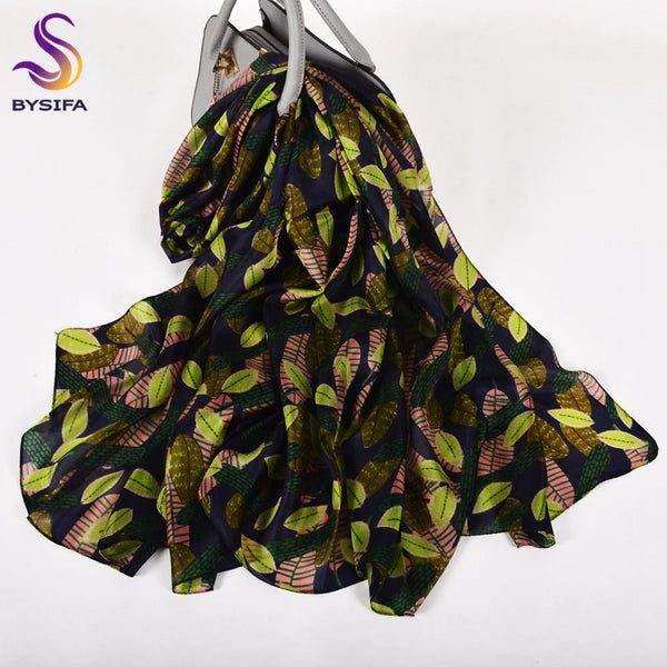 Model showcasing Autumn Whisper silk scarf in a chic evening outfit, highlighting versatility.