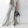 Luxe cashmere blend wide-leg pants for women, featuring a high waist, soft fabric, and comfortable elastic waistband.