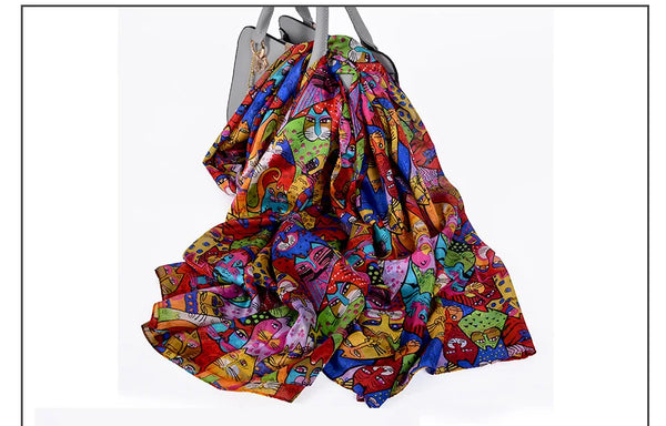 Autumn Whisper silk scarf wrapped around shoulders, emphasizing lightweight comfort.