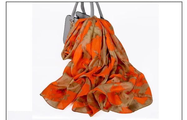 Detail of the blue and coffee hues in Autumn Whisper silk scarf, capturing its beauty.