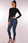 High-waist stretch skinny jeans for women in light vintage wash, featuring a button fly and a flattering slim fit.