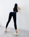 Black high-waist yoga leggings with seamless pockets, stylish women's activewear.