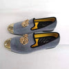 Men's slip-on shoes with a luxurious gold toe for evening events.