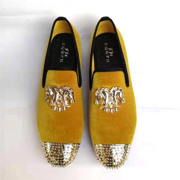 Fashionable slip-on loafers for men in rich velvet with gold accents.