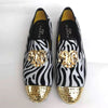 Elegant men's footwear in navy velvet with a luxurious gold toe.