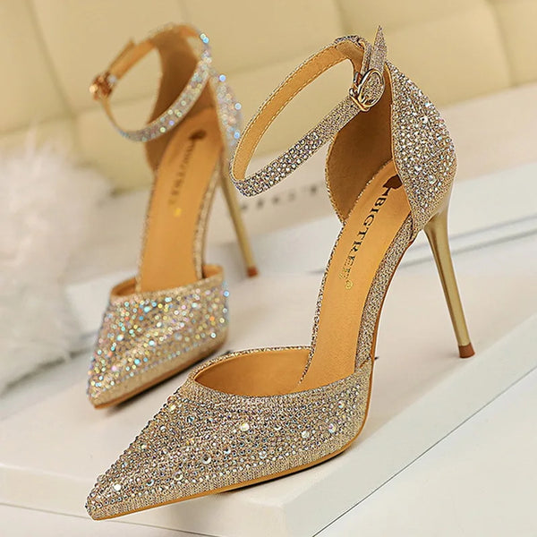 Rhinestone stiletto pumps with 10cm heels and crystal embellishments on white background