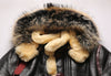 Luxury men's shearling leather bomber jacket in a snowy landscape.