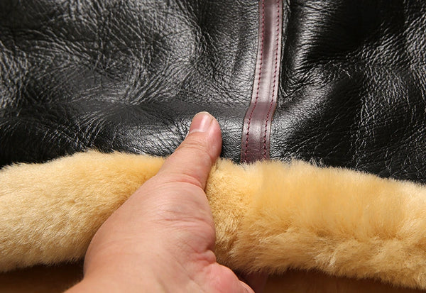 Luxury men's shearling leather bomber jacket with a tailored fit.
