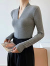 Elegant V-Neck Women's Blouse with Long Sleeves in solid color, perfect for casual and office wear, made from cotton-polyeste