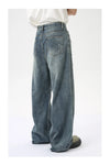Vintage washed blue denim jeans featuring wide leg and stretch comfort