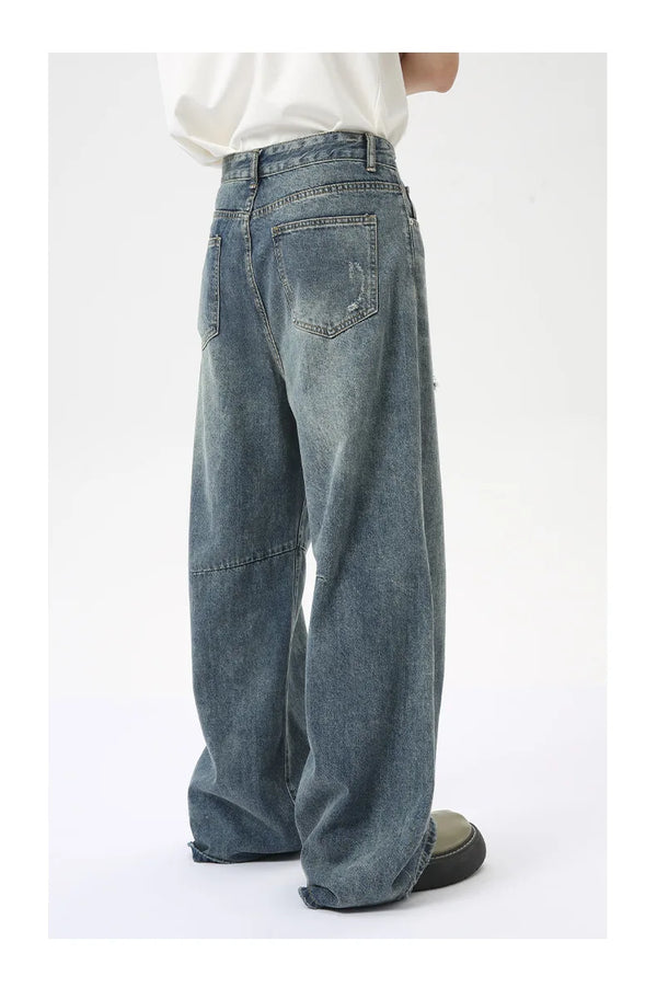 Vintage washed blue denim jeans featuring wide leg and stretch comfort