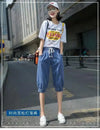Calf-length harem style jeans with elastic waist and relaxed flowing silhouette
