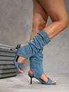 Contemporary mid-calf boots blending edgy denim with luxe suede