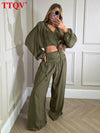 Coordinated outfit set with flattering wide-leg bottoms and sophisticated neckline detail