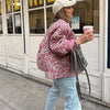 Cotton blend outerwear jacket featuring bold print and versatile button-front