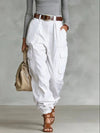 Women's high-waist overalls with functional pockets styled with casual top for effortless look