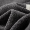Merino wool tracksuit set laid flat, emphasizing its breathable fabric and anti-pilling quality.