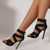 Elegant black open-toe heels with ankle-wrap and super high stilettos.