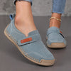 Handcrafted leather slip-on loafers in solid color with decorative buckle detail and low heel