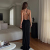 Sleek backless halter dress featuring modern waist cutouts for upscale events