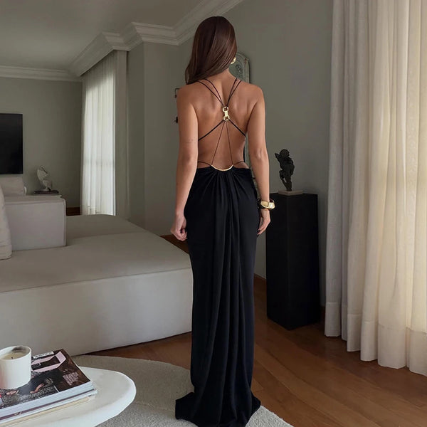 Sleek backless halter dress featuring modern waist cutouts for upscale events