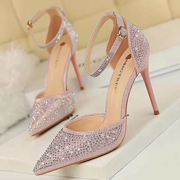 Back view of crystal-studded pumps showing thin stiletto heel and secure strap