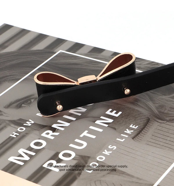 Elegant women's belt with bow detail in faux leather, perfect for casual and formal outfits, featuring a sleek metal buckle.