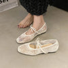 Beige ballet flats with square toe silhouette and decorative bow accent for effortless style