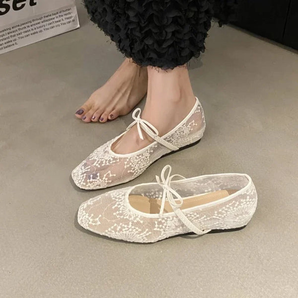 Beige ballet flats with square toe silhouette and decorative bow accent for effortless style