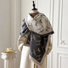 Floral cashmere poncho, combining warmth and style for cold evenings.